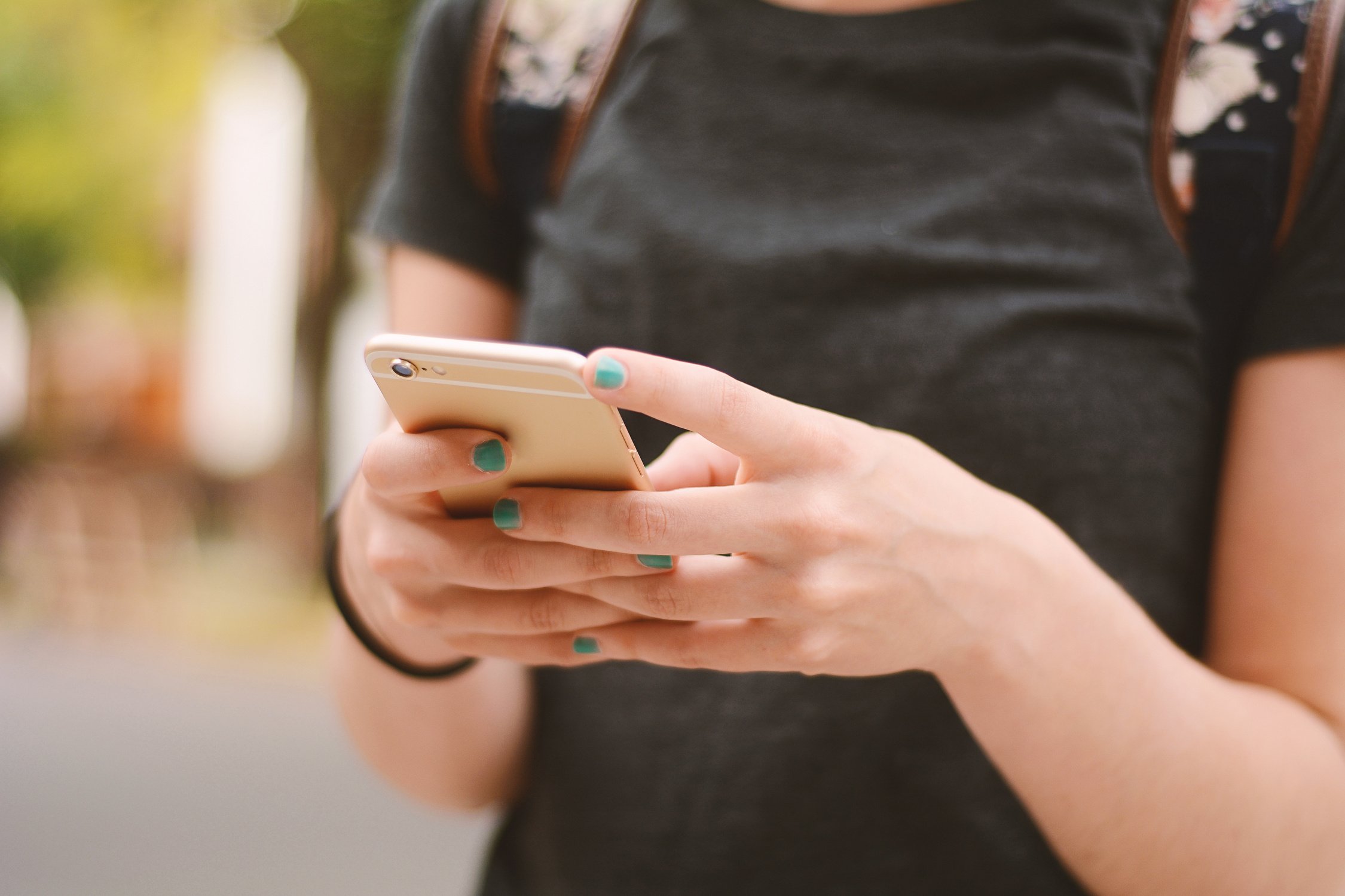 Close up of Woman's Hands Texting with Smartphone